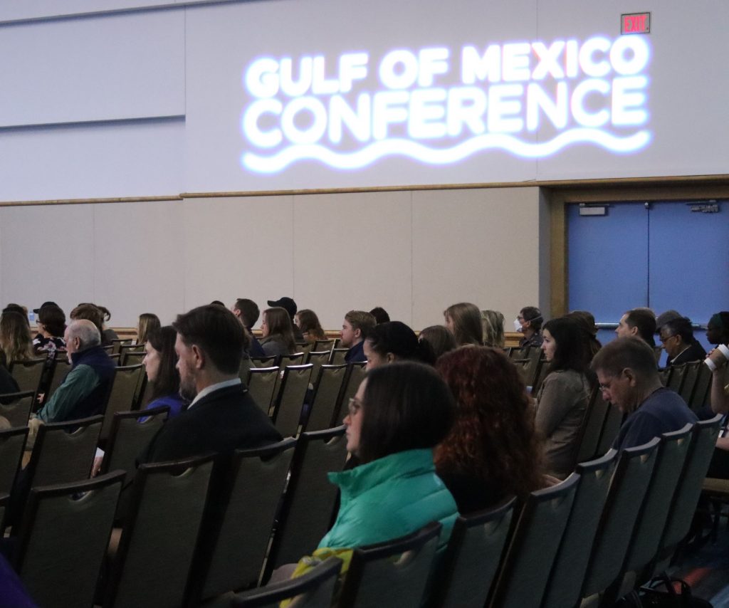 audience with signage that says Gulf of Mexico Conference